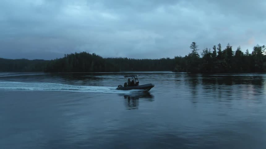 A boat that is sailing on a river