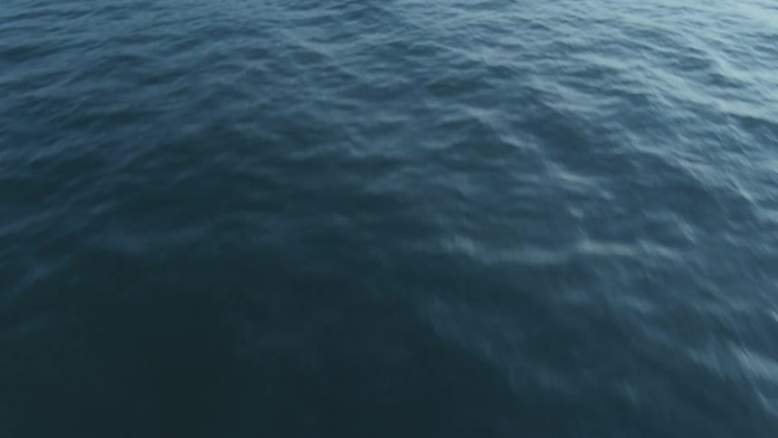 Aerial view of the ripples and waves on the surface of the ocean