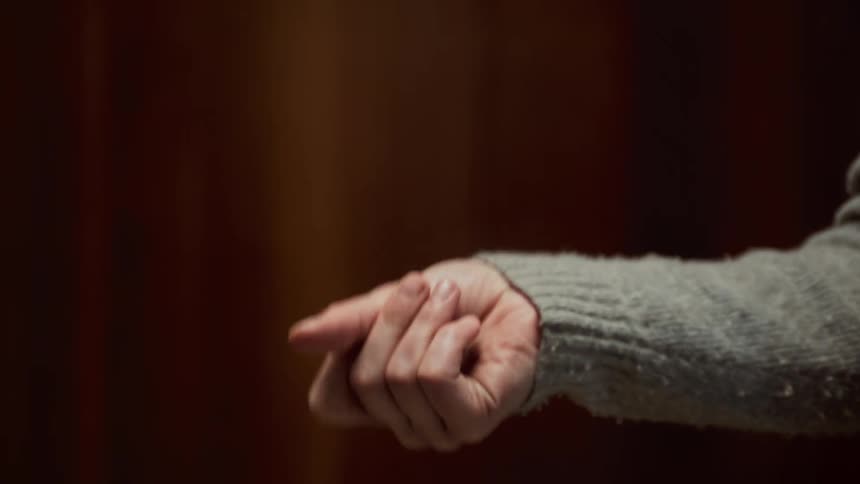 Close up of a persons arm as they flick their wrist around