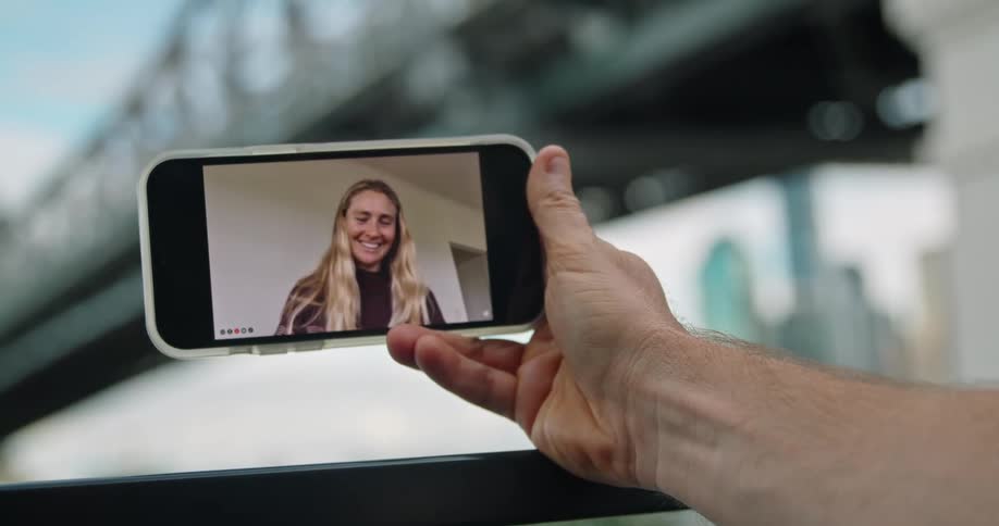 A woman talking on a smartphone screen