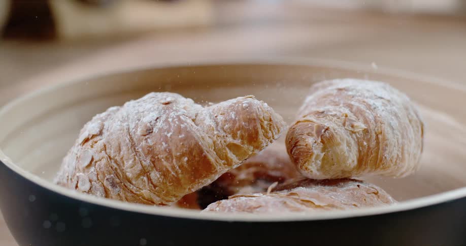 Croissants falling in to a bowl