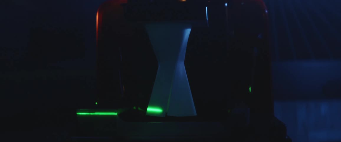 A laser passing over a white object