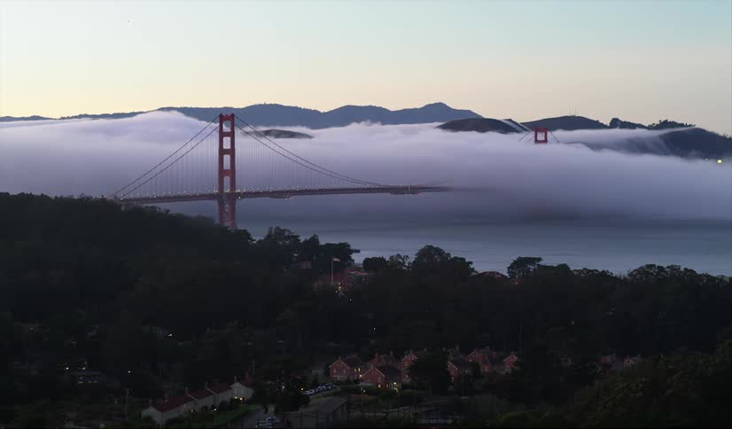 A view of the golden gate bridge on a foggy morning