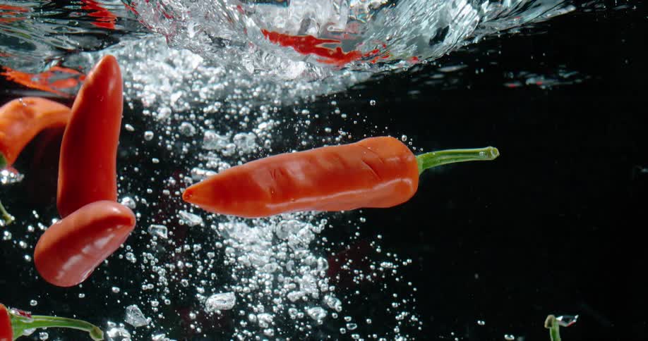 Peppers fall and sink in the water