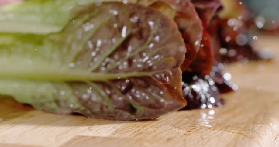 Lettuce is on a table and washed in water