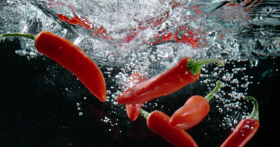 Peppers are falling into liquid water