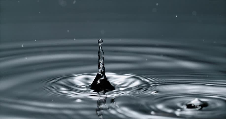 Droplets of water falling on to a lake and causing ripples