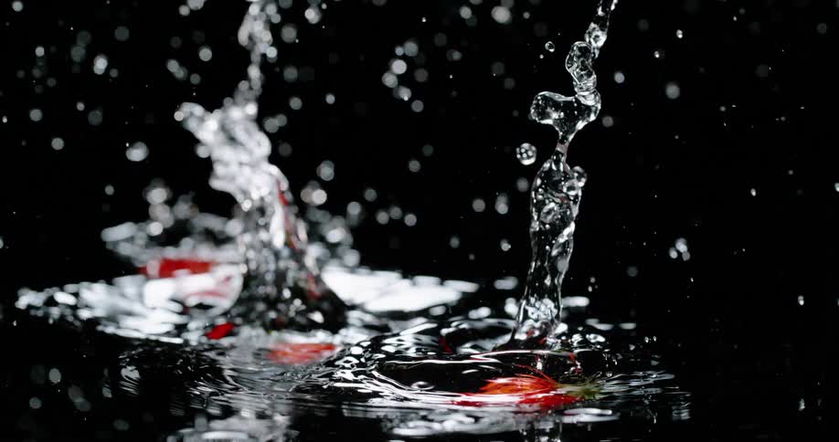 Strawberries are falling into water on display