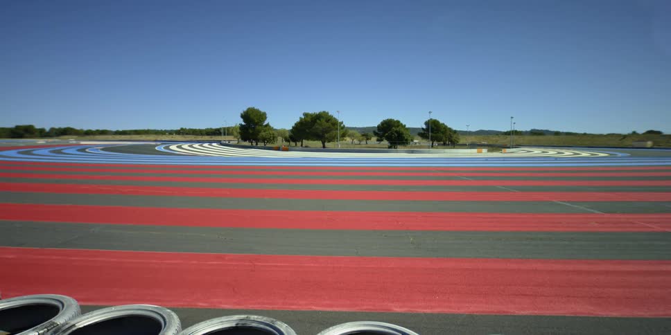 An empty racetrack is displayed in spring
