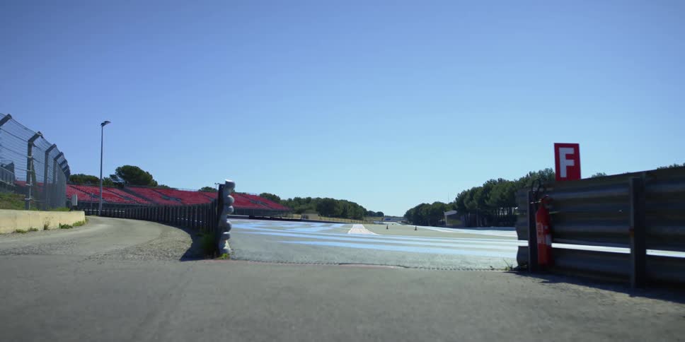 A car drives on the raceway ahead