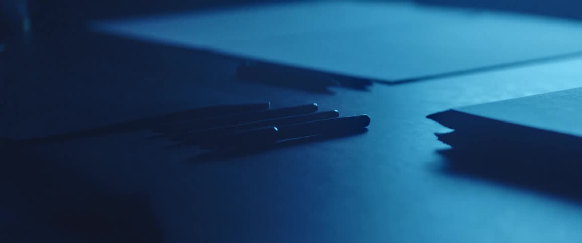 Pens and papers sitting on a desk
