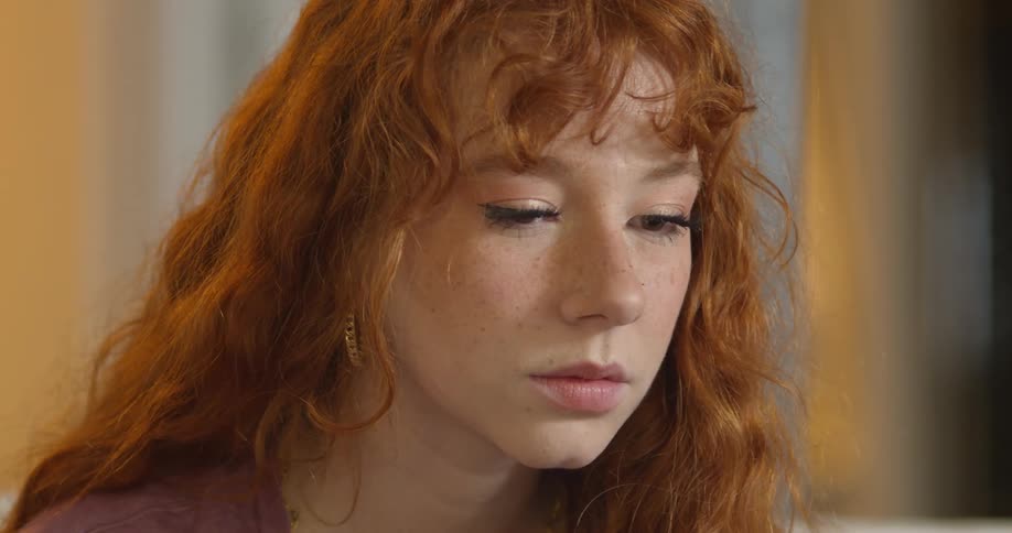Close up of the face of a redhead woman