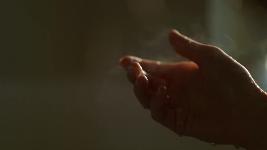 Steam coming out of a wet hand