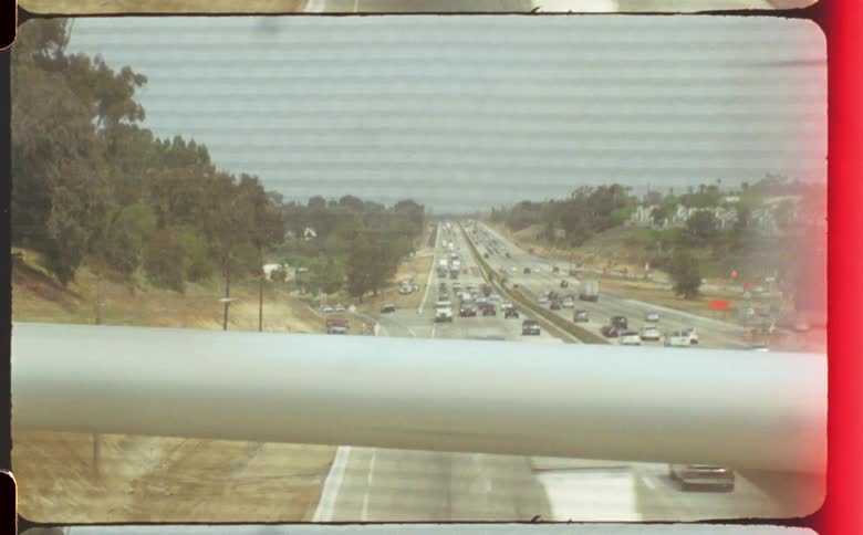 Cars traveling on a busy city freeway in the daytime