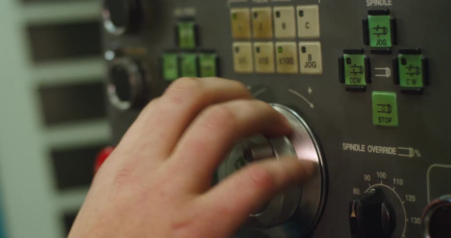 A person is turning the dial on the machine