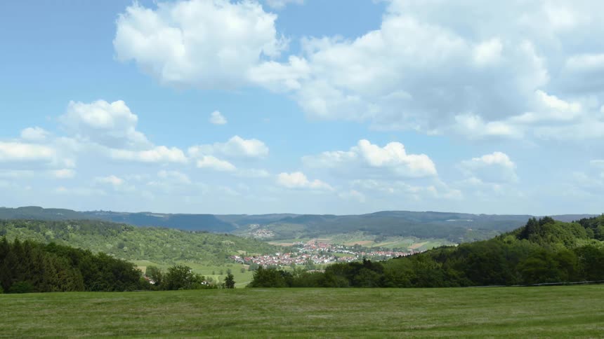 A town is ahead down the hill