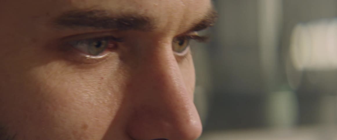 Close up of the eyes of a man talking