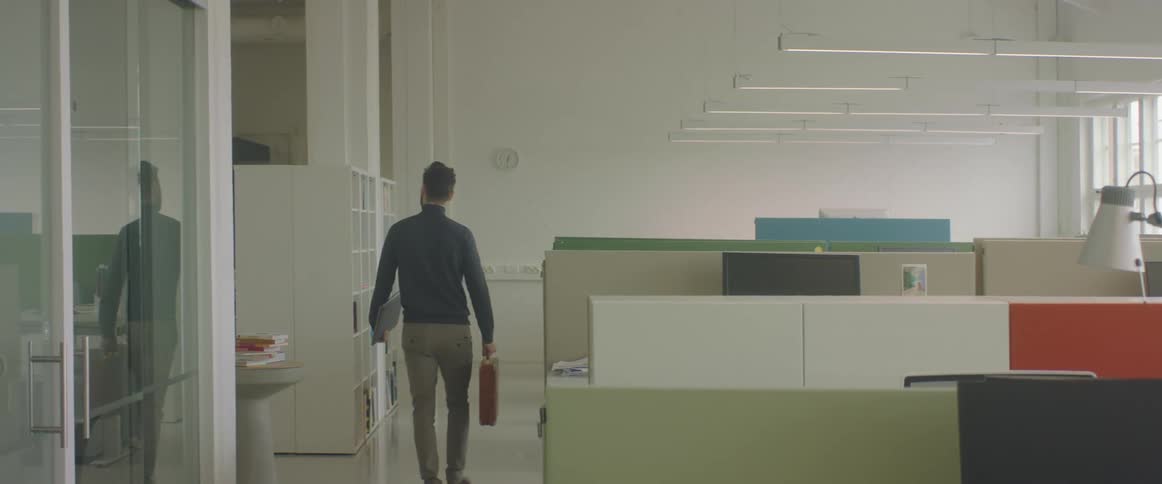 A man is walking out of the office