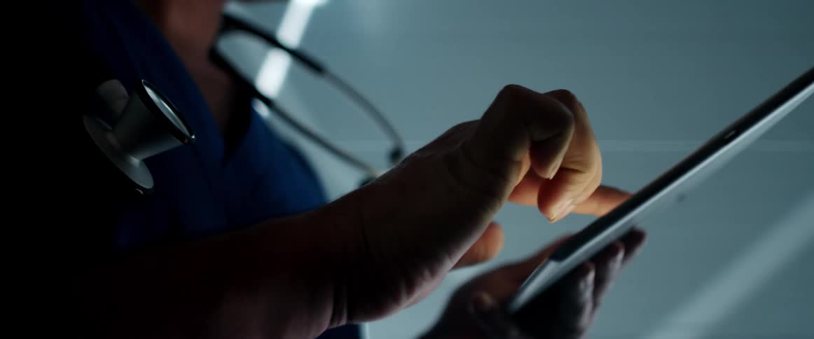 A person using a tablet in a room