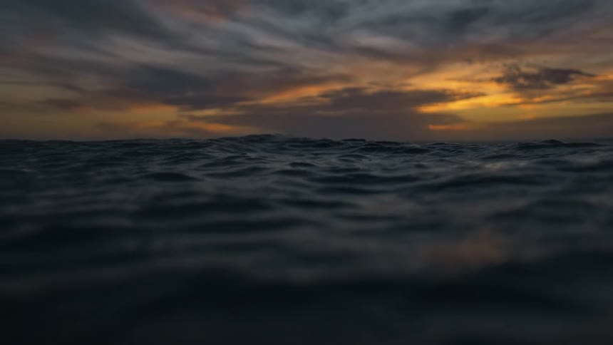 View of choppy sea at dusk