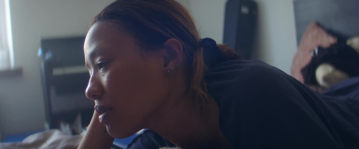 Woman relaxing over the bed in the bedroom at home