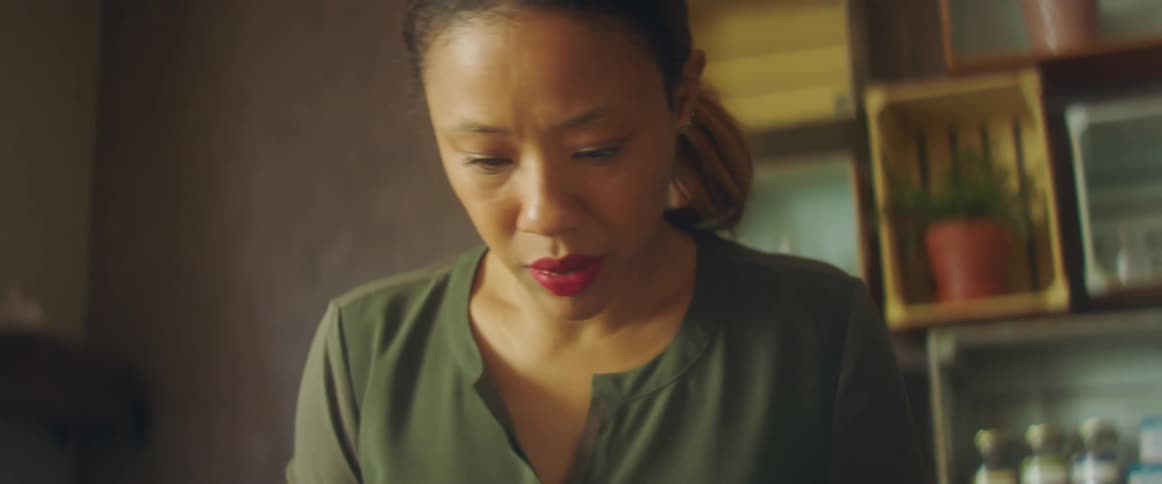 A woman is standing in a room indoors