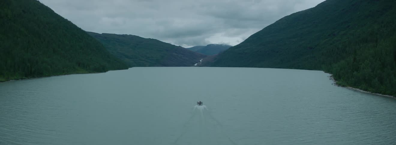 A boat is traveling down the long river