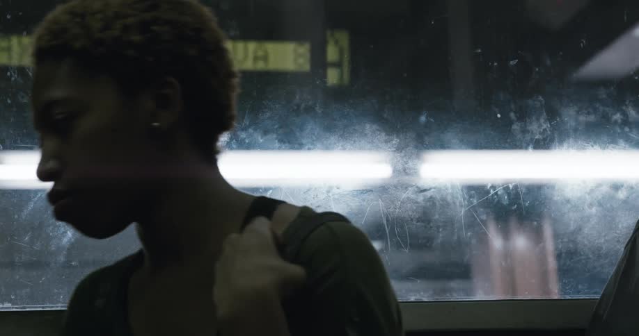 A woman riding on a subway train