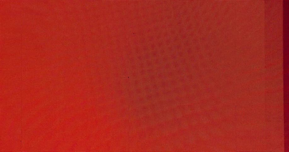 Red fabric covers the black space