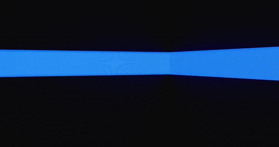 Blue rectangular shapes meeting to form corner grow to fill black background on screen