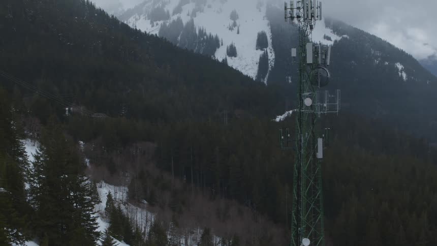 Pullback traverse of a tall cellular communications tower in the mountains