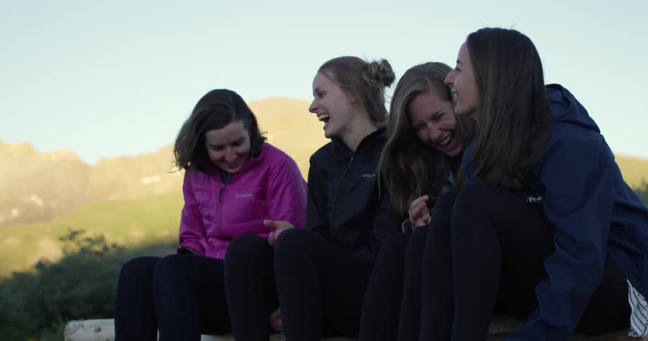 Friends sit talk and laugh together
