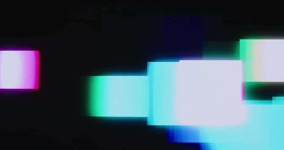 Square and rectangular blocks of various colors move across a black background on screen