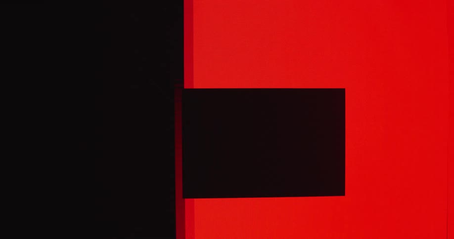 Red color flows across black screen leaving rectangular shapes