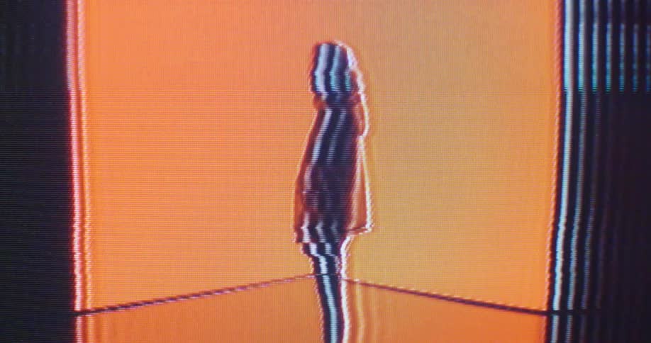 A digitalized woman is standing in a room