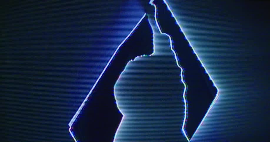 Black blue and gray colors that look like a woman dancing in front of a spinning cube