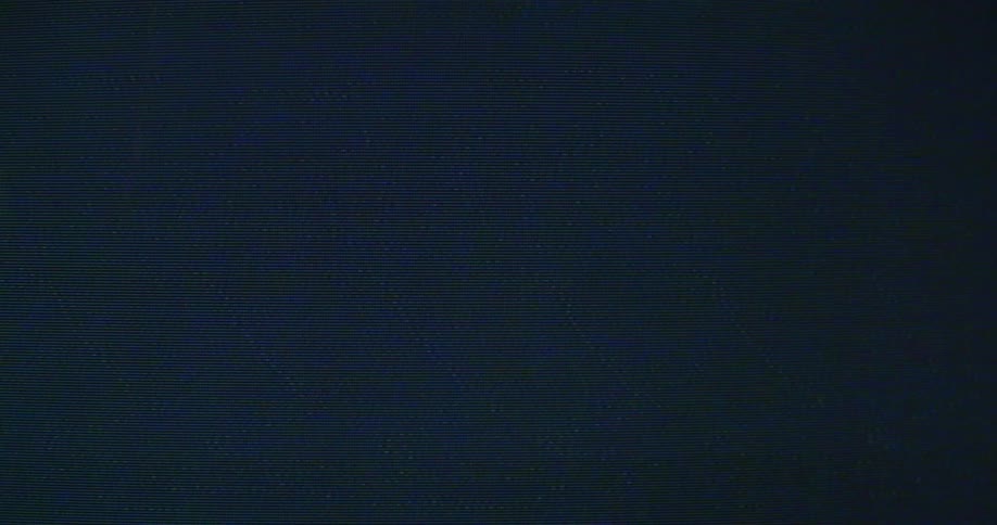 A screensaver flashes across a screen and then turns fuzzy
