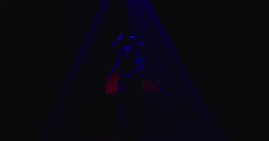 A woman is dancing on the stage