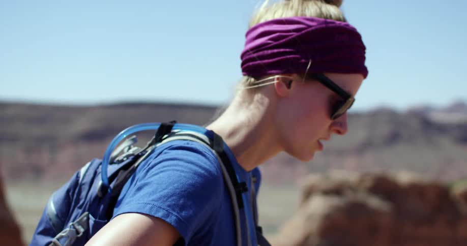 A woman on a mountain during the day