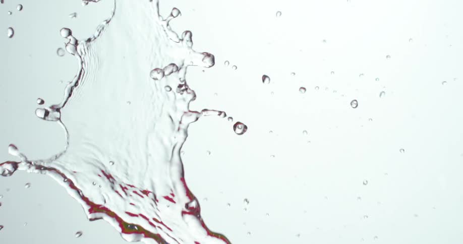 Water splashing against a white background