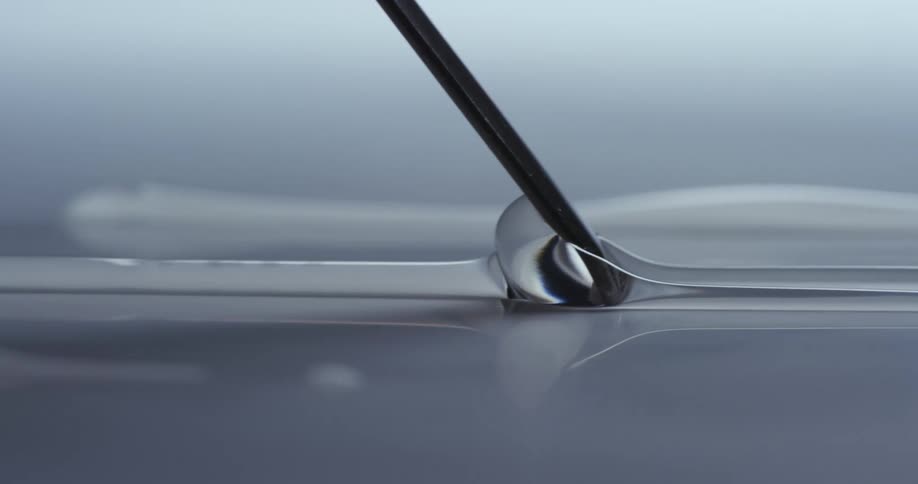 A stick spreads the line of glue
