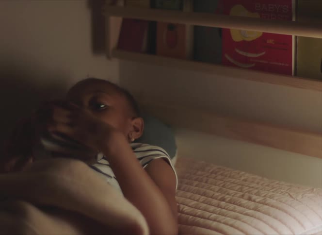 Girl laying in bed on her bedroom at home