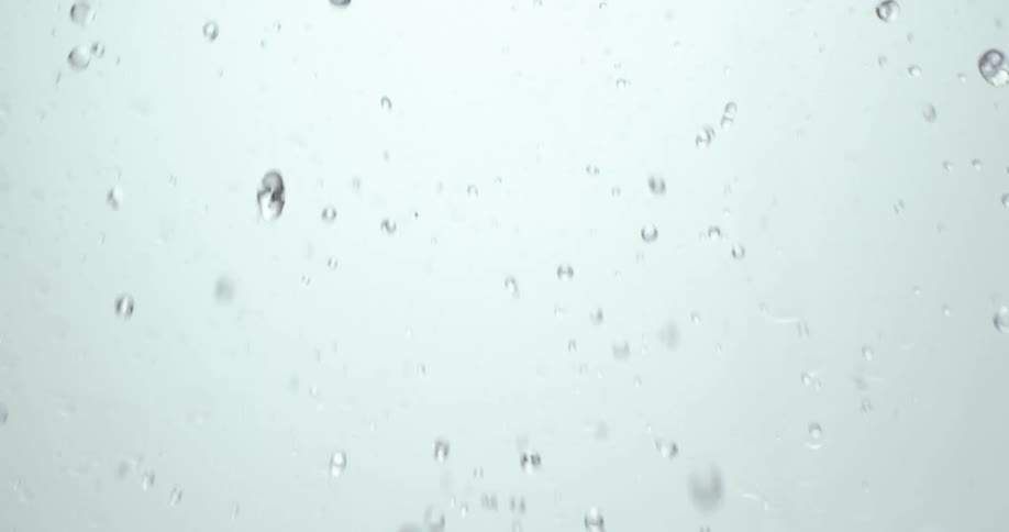 A stream of water splashes and results in droplets spraying everywhere