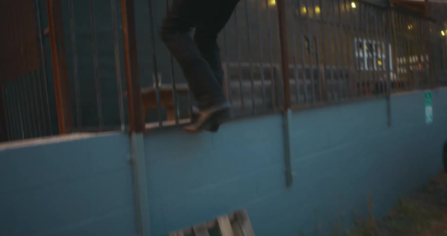 A man is climbing a balcony in spring