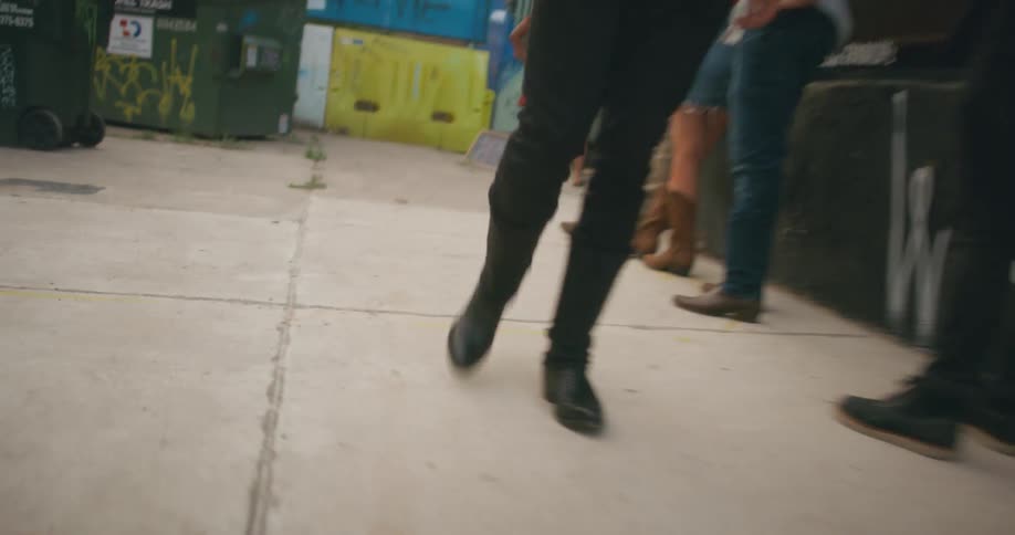 Man is walking in an alleyway
