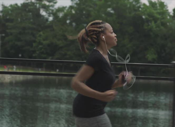 A woman running on a sidewalk