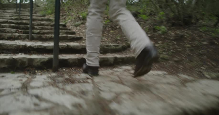 A person running up stairs outdoors