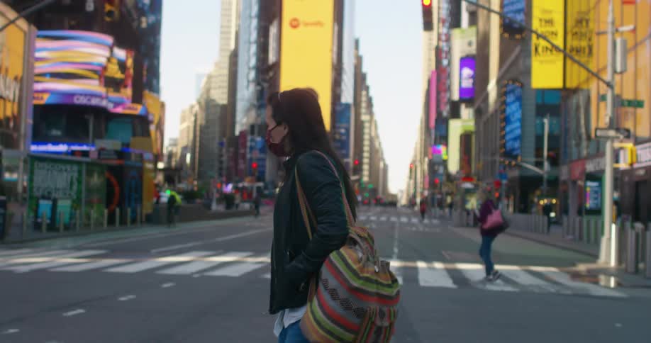 A woman is crossing the street