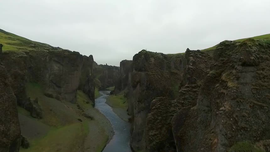 A river runs through a steep-walled gorge