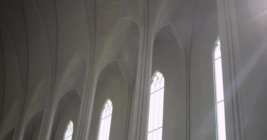 Inside shot of tall arched glass windows